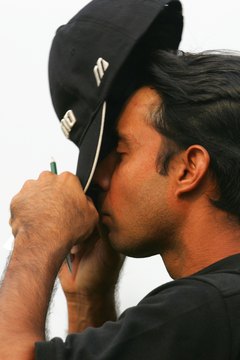 Cleaning a golf cap properly can prevent sweat stains.