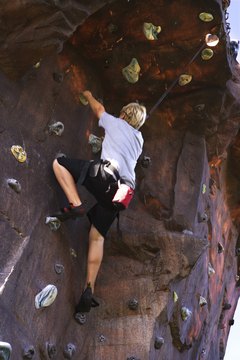 Thinkstock/Stockbyte/Getty Images Rock climbing can help build and tone your legs and glutes.