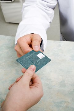Jupiterimages/Comstock/Getty Images A guarantor risks assuming responsibility for another person's credit management.