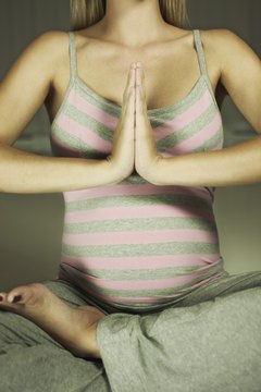 Brand X Pictures/Brand X Pictures/Getty Images Pregnancy, for example, limits what poses are safe.