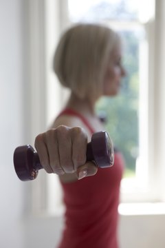 Jupiterimages/Polka Dot/Getty Images You can still get a great workout using smaller weights.