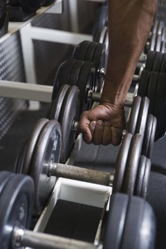 Jupiterimages/Comstock/Getty Images Dumbbell rows don't focus on your biceps.