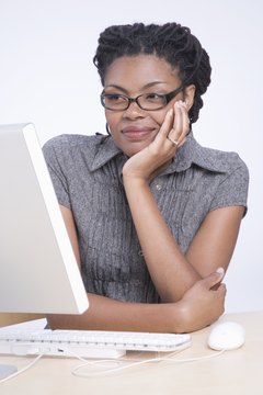 Jack Hollingsworth/Photodisc/Getty Images Work from home as a personal virtual assistant.