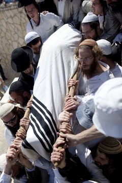 Mourners in Israel carry a body shrouded rather than placed in a casket.