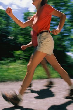 Stockbyte/Stockbyte/Getty Images Power walk with a girlfriend to prevent boredom.