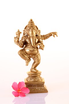 A dancing four-armed Ganesh is a popular and powerful Hindu god.