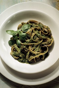 Eising/Photodisc/Getty Images Pesto is commonly added to cooked pasta.
