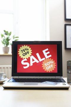 Sale advertisment on screen of laptop