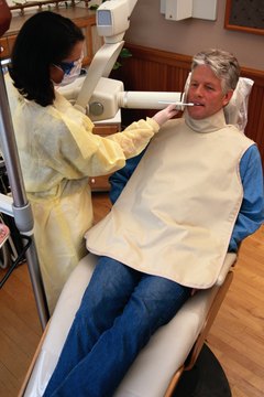 Keith Brofsky/Photodisc/Getty Images Dental hygienists can perform X-rays or administer anesthetics in many states.