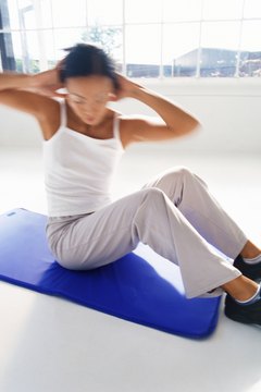 George Doyle/Stockbyte/Getty Images Rotational Pilates exercises target your obliques.