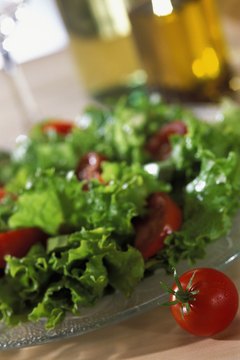 Medioimages/Photodisc/Photodisc/Getty Images Lettuce and tomatoes deliver fiber and vitamin A.