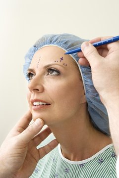 Jupiterimages/Comstock/Getty Images Plastic surgeons usually map out incisions to show patients what to expect.