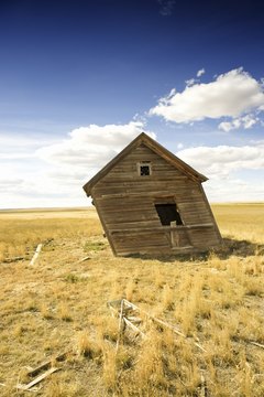 Jupiterimages/Comstock/Getty Images Always visit the property prior to the auction to get an idea of the market value.