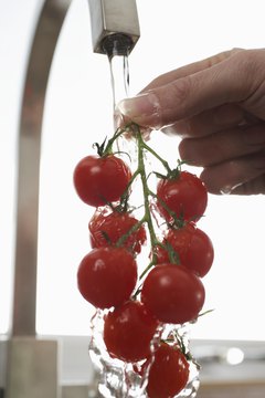 Martin Poole/Digital Vision/Getty Images Most of the calories in cherry tomatoes come from carbohydrates.