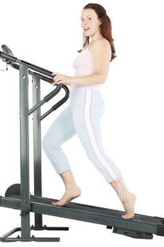 Photos.com/PhotoObjects.net/Getty Images The treadmill helps you shed visceral stomach fat.