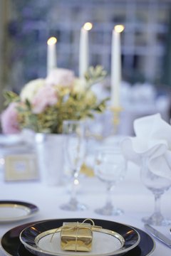 Buccina Studios/Photodisc/Getty Images Make your own wedding favors with flowers.