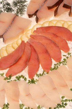 Jupiterimages/Comstock/Getty Images Keep healthy protein foods such as frozen chicken breast slices and canned tuna in your kitchen for a fast, balanced dinner.