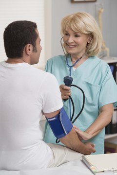 Jupiterimages/Comstock/Getty Images Occupational health and industrial nurses help mitigate health and safety risks to employees.