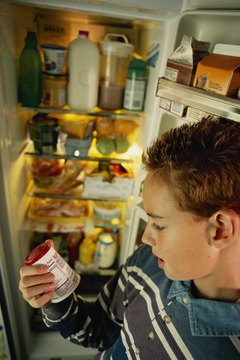 Brand X Pictures/Brand X Pictures/Getty Images Always read the yogurt label before sharing with your dog.