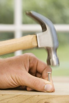 Jupiterimages/Polka Dot/Getty Images A HUD home might require construction skills.