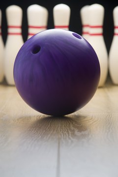 BananaStock/BananaStock/Getty Images Master the art of sending your ball straight down the lane.