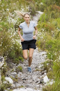 Jupiterimages/Pixland/Getty Images Grooved and rocky ground gives more of a challenge while walking uphill.