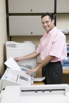 Businessman using fax machine