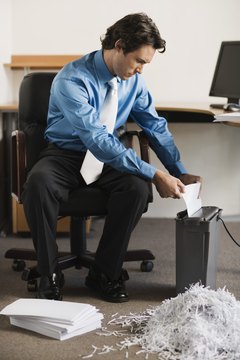 Brand X Pictures/Brand X Pictures/Getty Images Qualified resume writers keep resumes in employers' hands instead of the shredder.