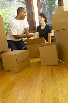 Hemera Technologies/AbleStock.com/Getty Images Your home coverage will need to be extended to cover your partner's belongings.