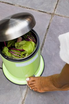 Jupiterimages/Creatas/Getty Images Go green and build your own homemade composting bin.