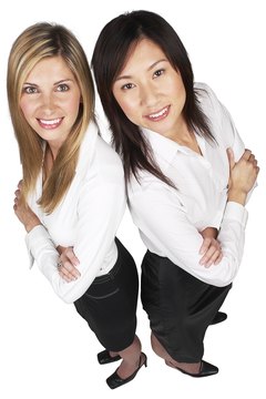 Hemera Technologies/PhotoObjects.net/Getty Images Job sharing may cause some loss of each individual's workplace identity.