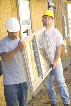 Brand X Pictures/Brand X Pictures/Getty Images Replacement windows save less energy than improved roof insulation.