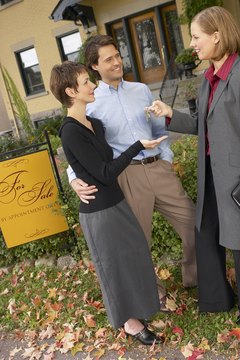 Hemera Technologies/AbleStock.com/Getty Images How you handle money becomes important after buying a home.