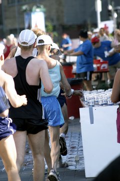 Jupiterimages/Photos.com/Getty Images A hydration belt means you won't get waylaid at crowded water stops.