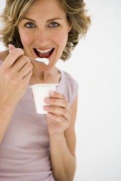 Jupiterimages/Pixland/Getty Images Snack on yogurt for probiotic benefits.