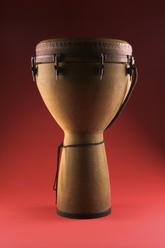 Make a replica of a Kenyan tribal drum with cups.