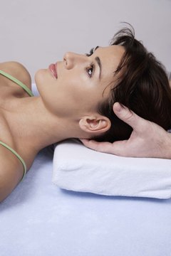 Jupiterimages/Goodshoot/Getty Images Chiropractors need good hand strength and dexterity for treatment.