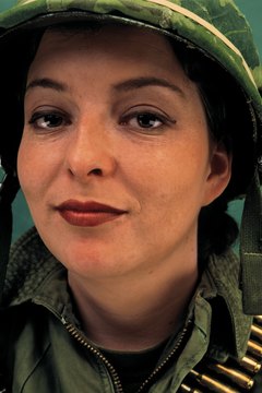 Stockbyte/Stockbyte/Getty Images Anywhere from 100,000 to 125,000 to civilian contractors serve overseas.