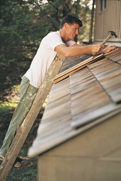 Comstock/Comstock/Getty Images Eco-friendly roofing can lower surface temperatures (see Reference 5).