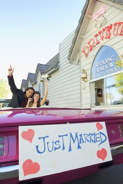 Jupiterimages/Comstock/Getty Images Some insurance policies give married couples an automatic discount.