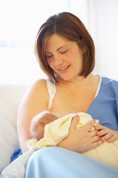 Jupiterimages/Photos.com/Getty Images Lactation consultants help new mothers breastfeed successfully.