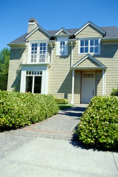 Ryan McVay/Digital Vision/Getty Images Small houses offer both functionality and value.