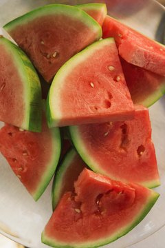 Jupiterimages/Comstock/Getty Images Eating more melon ups your fiber intake.