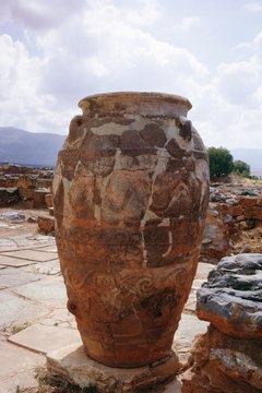 Carved urns depict ancient Grecian funeral rites.