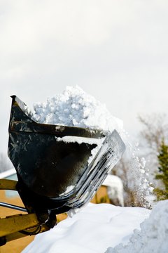 Jupiterimages/Photos.com/Getty Images Clearing snow can be a profitable winter job.