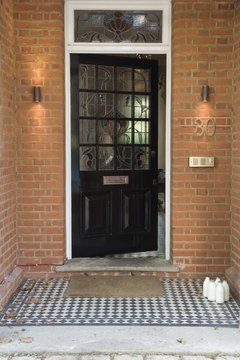 Jupiterimages/Polka Dot/Getty Images Not all exterior door replacements qualify for federal, state or local tax credits.