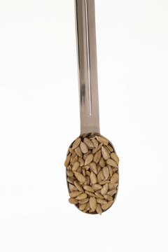 Jupiterimages/Comstock/Getty Images Sunflower seeds make a crunchy, savory snack.