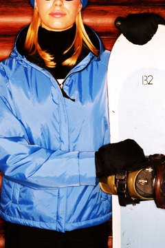 Stockbyte/Stockbyte/Getty Images Your snowboard's length should correspond with your height.