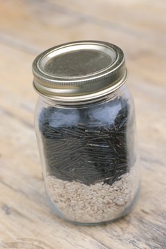 Hemera Technologies/Photos.com/Getty Images Glass canning jars store dry goods, as well as liquids.
