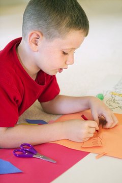 Fine-motor skills enable a child to cut and color successfully.